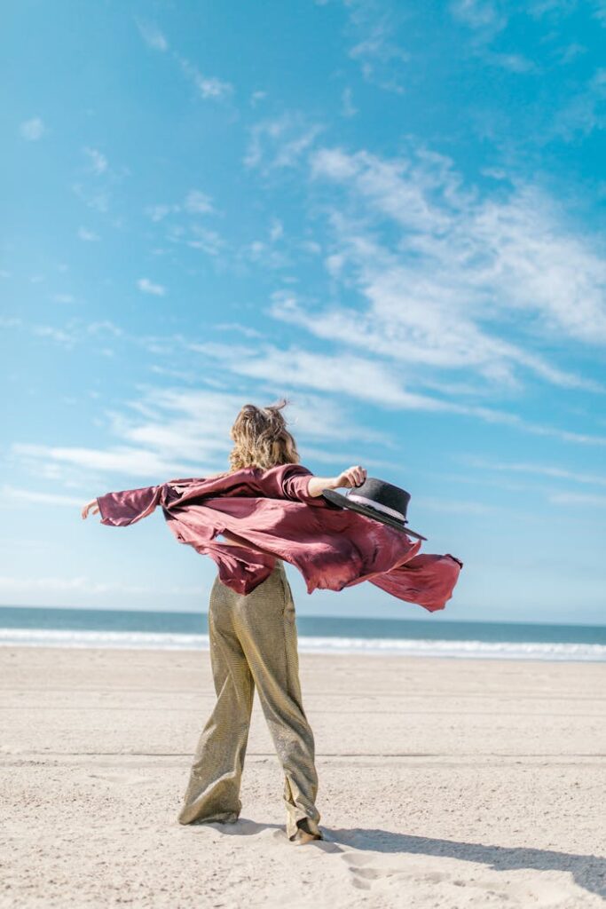 pexels-photo-6806538 Man in Red and Brown Plaid Dress Shirt and Brown Pants Carrying Black and White Backpack